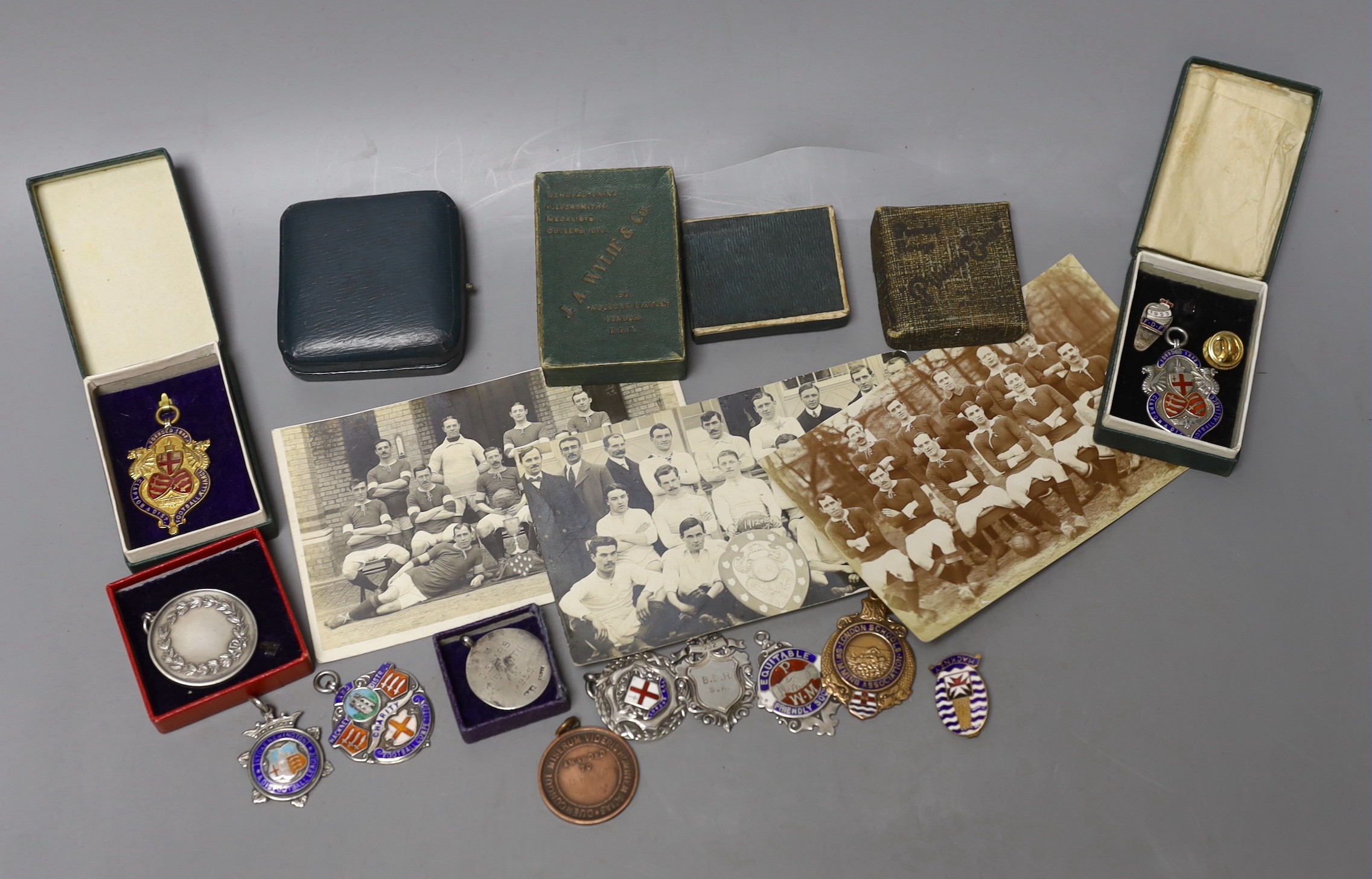 Assorted pre war football medals including silver.